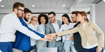 Diverse marketing team uniting hands in a gesture of collaboration and global talent synergy